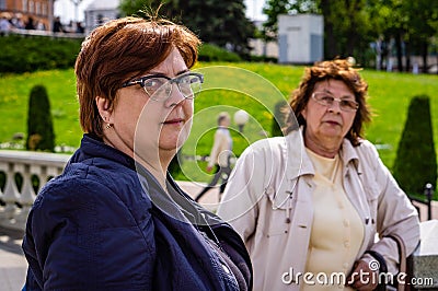 Two old ladies walking in the city Park Stock Photo