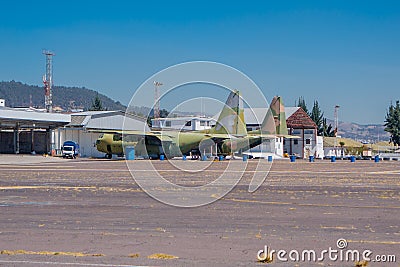 Two old military airplanes parked in the air strip waiting to be repaired Editorial Stock Photo