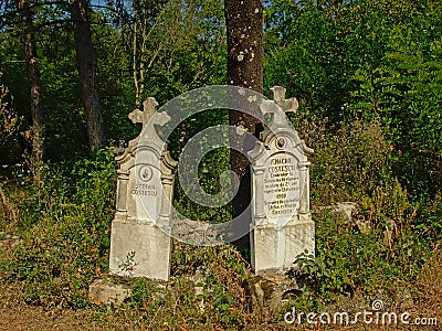 Two old Stone grave monuments in the Romanian countryside Editorial Stock Photo