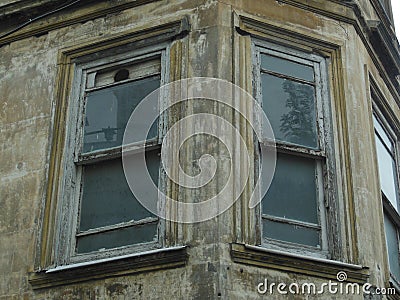 Two old windows in ruined wall of some building Stock Photo