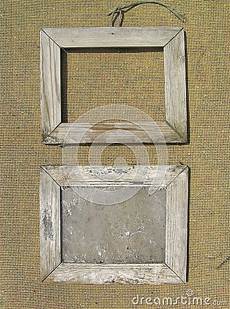 Two old wooden picture frame on the burlap. Stock Photo