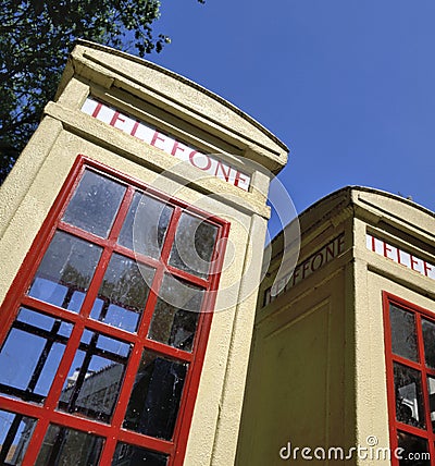 Two oldfashioned telephone booths Stock Photo