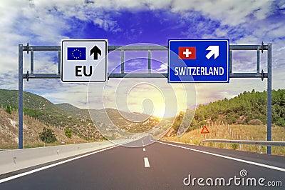 Two options EU and Switzerland on road signs on highway Stock Photo