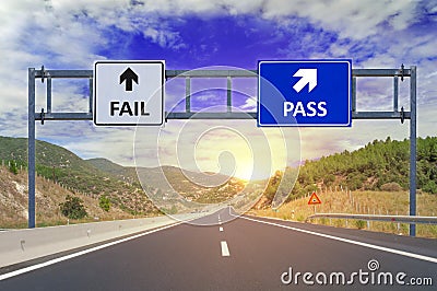 Two options Fail and Pass on road signs on highway Stock Photo