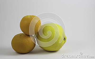 Two oranges and a lemon Stock Photo