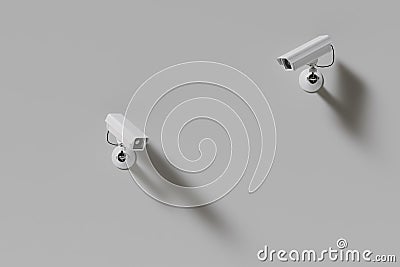 two outdoor surveillance cameras on a white wall Stock Photo