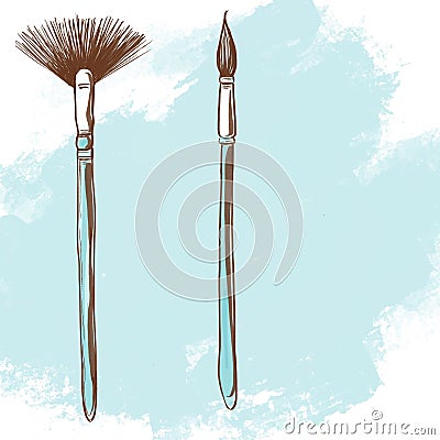 Two painting brushes on a light blue background. Stock Photo