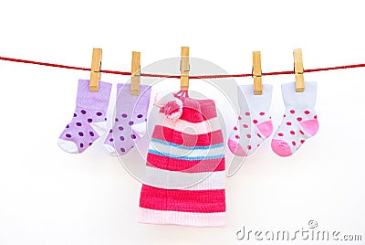 Two pairs baby socks and a cap Stock Photo