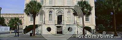 Two palms in front of historic home in Charleston, SC Editorial Stock Photo