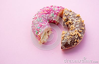 Two parts of donuts, pink and chocolate Stock Photo