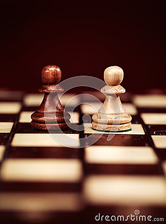 Two pawns on chessboard Stock Photo