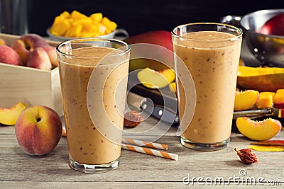 Two Peach Mango Smoothies in Glasses Stock Photo