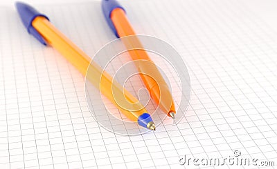 Two pen on the checked paper Stock Photo