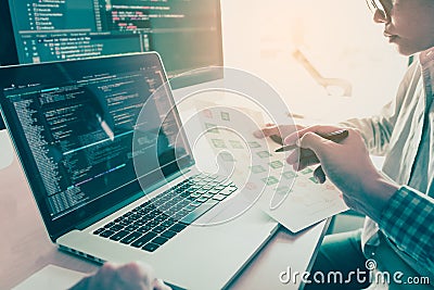 Two people coding code program programming developer computer web development coder working design software on desk in office Stock Photo