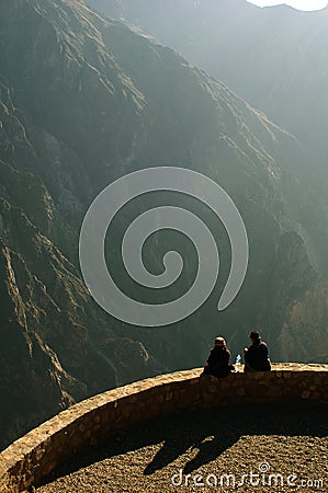 Two people on the edge of Colca Canyon Stock Photo