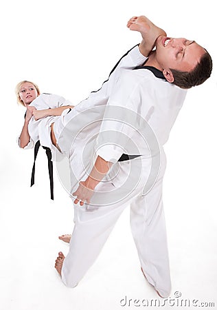 Two people in kimono fight on white Stock Photo