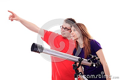 Two people observe through a telescope Stock Photo