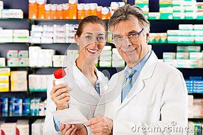 Two pharmacists in pharmacy consulting Stock Photo