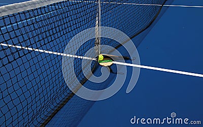 Two pickleball paddles with a whiffle ball at the net Stock Photo