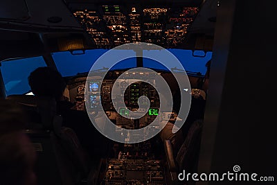 Two pilots sitting in a cockpit of a jet airplane Editorial Stock Photo