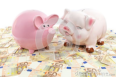 Two pink piggy banks on spread euro notes Stock Photo