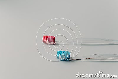 Two plastic toothbrushes for hygiene cavity mouth with lateral side isolated over white background. Dental concept Stock Photo