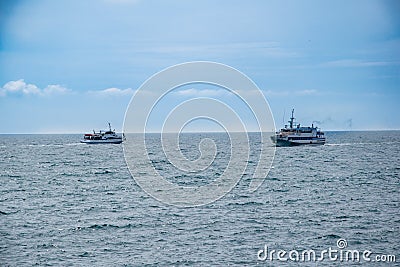 Two pleasure boats diverged in the sea. Two pleasure tourist ships go to sea. Walk on the sea, travel of tourists. Stock Photo