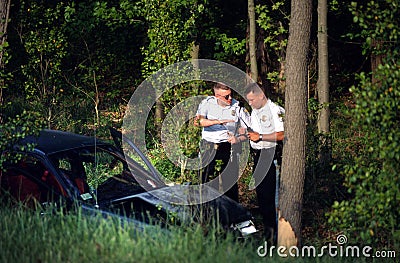 Two Policeman discuss a accident Editorial Stock Photo