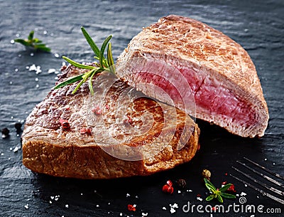 Two portions of lean trimmed grilled beef steak Stock Photo