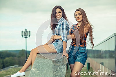 Two positive hipster girlfriends. Stock Photo
