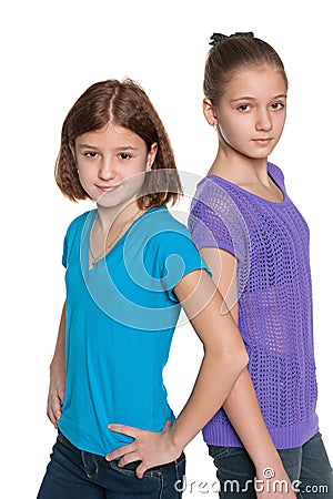 Two preteen girls against the white Stock Photo