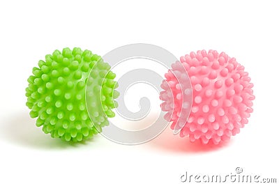 Two prickly plastic balls green and pink on white background Stock Photo