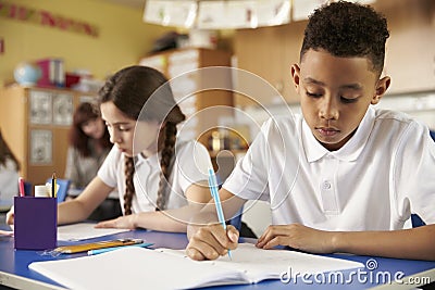 Two primary school pupils at their desks in class, close up Stock Photo