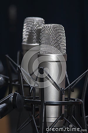 Two professional studio microphones on stands, podcasting, voiceover Stock Photo