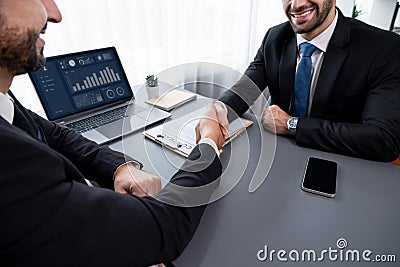 Closeup handshake in after successful business meeting. Fervent Stock Photo