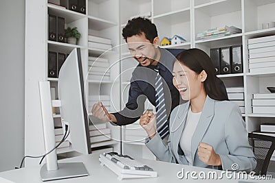 Two programmers looking at computer screen, programmer design custom computer programming, programming code and website. Computer Stock Photo