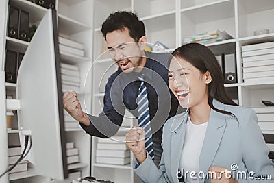 Two programmers looking at computer screen, programmer design custom computer programming, programming code and website. Computer Stock Photo