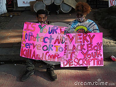 Two Protesters With Their Signs Editorial Stock Photo