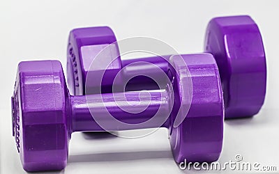 Two Purple dumbbells plastic Stock Photo