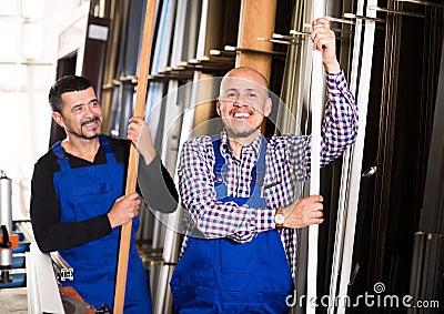 Two PVC industry workers in coveralls Stock Photo