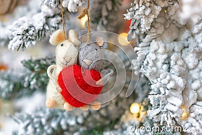 Two rats hanging on a Christmas tree, holiday decoration Stock Photo