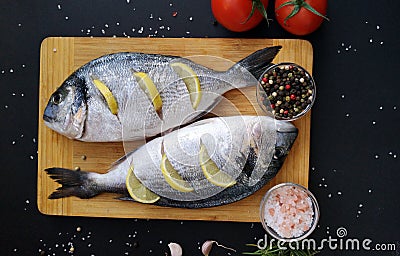 Two ready to cook fresh dorada fish Stock Photo