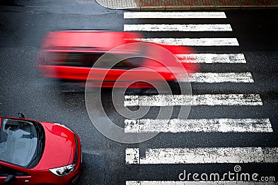 Two red cars on the pedestrian crossing Stock Photo