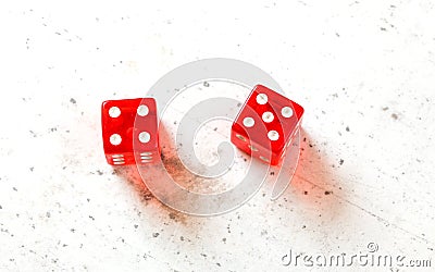 Two red craps dices showing Centerfield Nine / Nina number 4 and 5 overhead shot on white board Stock Photo
