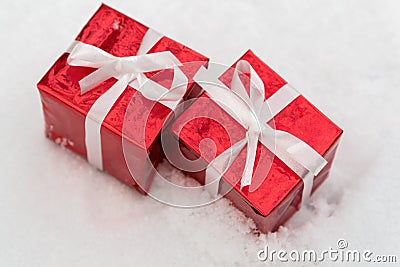 Two red gifts for christmas on snow Stock Photo