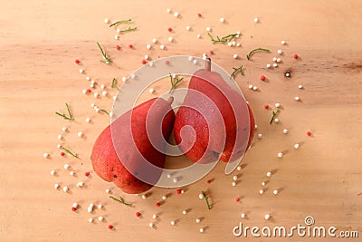 Two red pears on a wooden table like christmas nuance Stock Photo