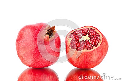 Two red ripe pomegranates whole and cutted on white background isolated close up Stock Photo