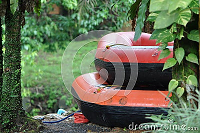 Two red stacked inflatable rapid rafts Stock Photo
