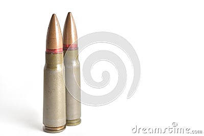 Two rifle bullets isolated on a white background. Military ammunition Stock Photo