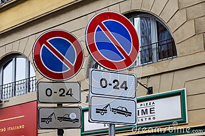 Road signs with no parking with removal of the vehicle. Editorial Stock Photo